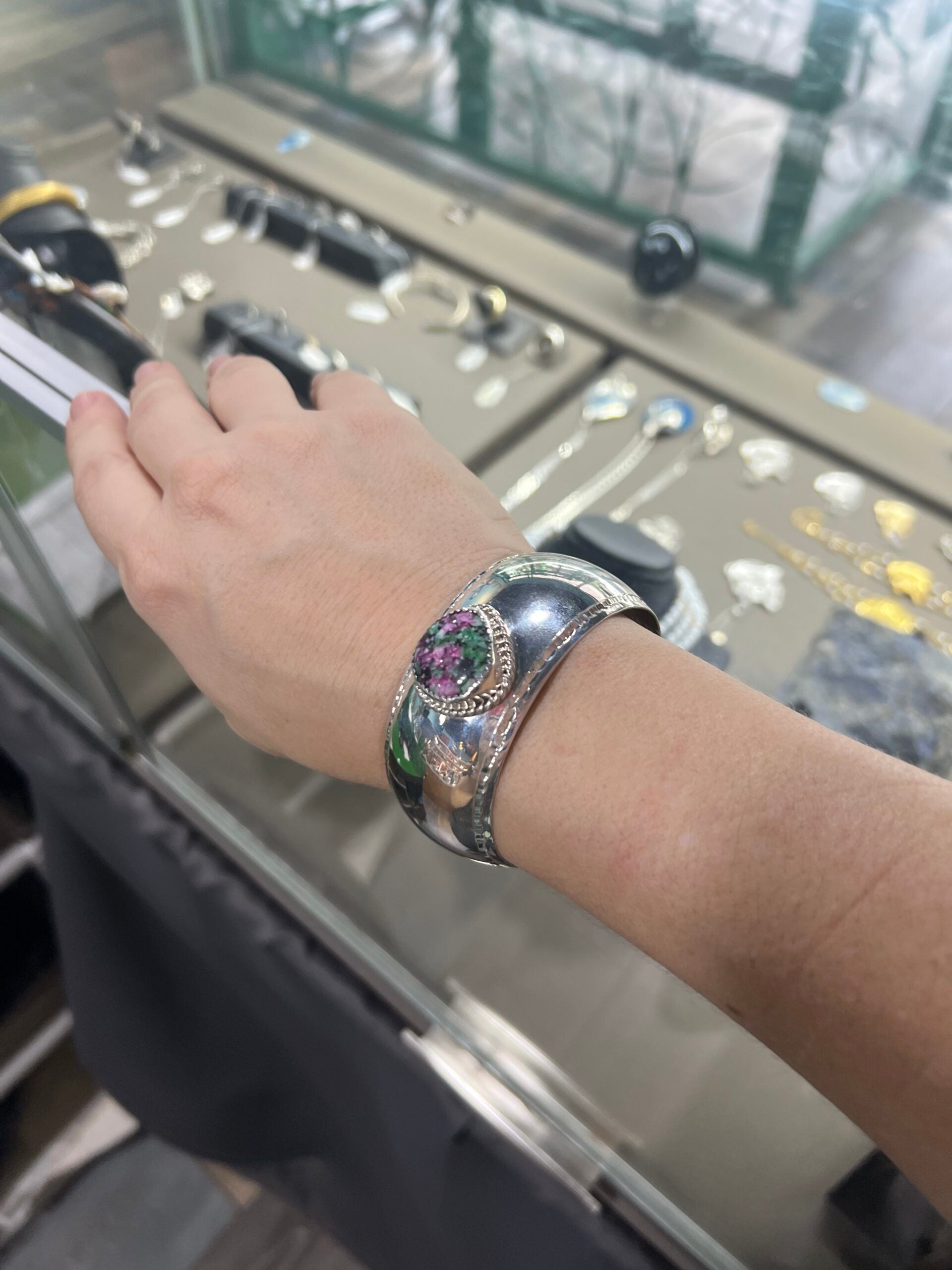 ruby in matrix sterling silver cuff bracelet on wrist