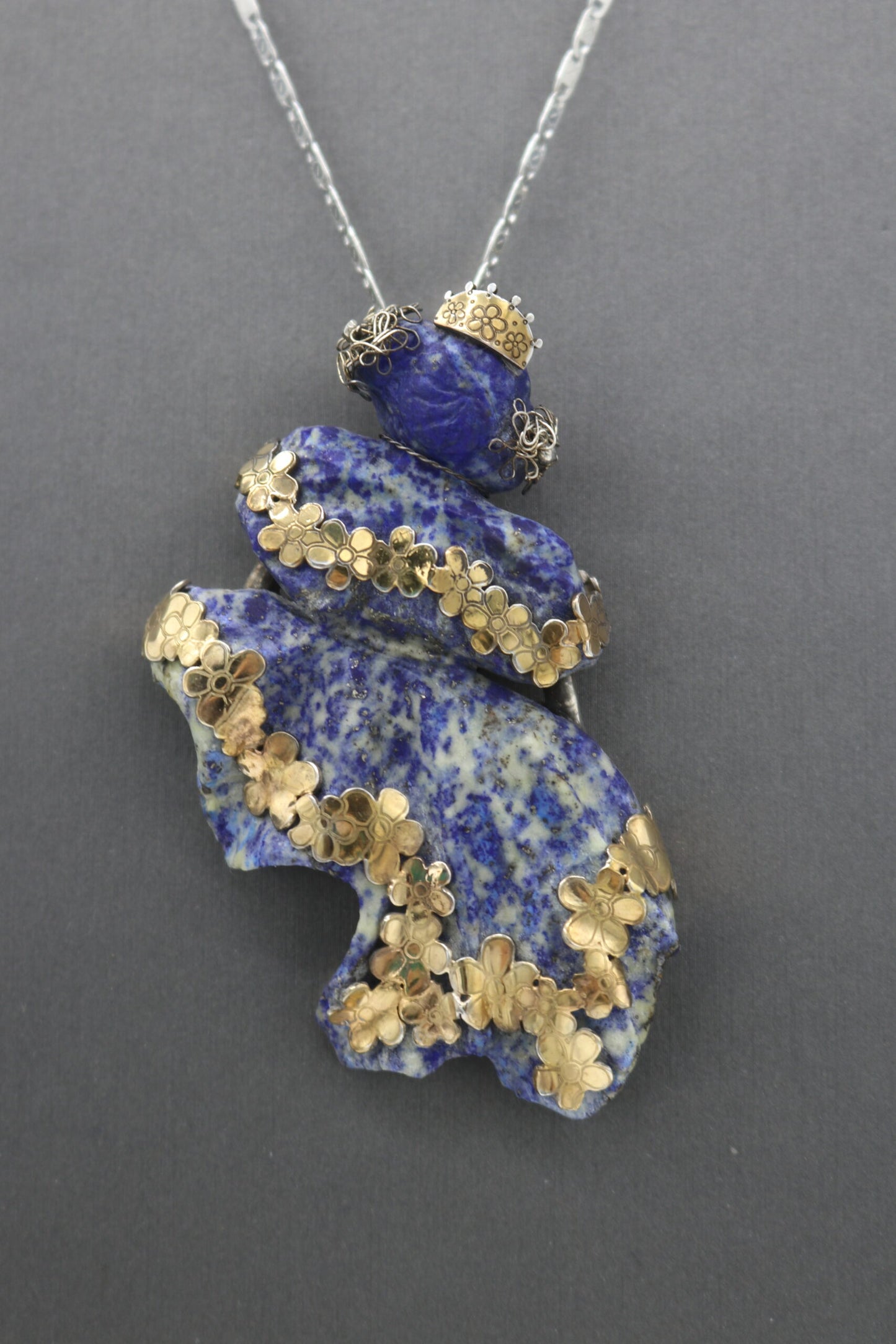 hand carved lapis lazuli pollera dancer with sterling silver and gold plated adornments